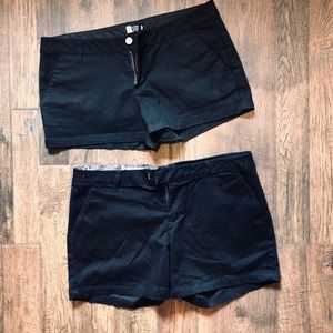 2 pairs of black Volcom shorts size 9.